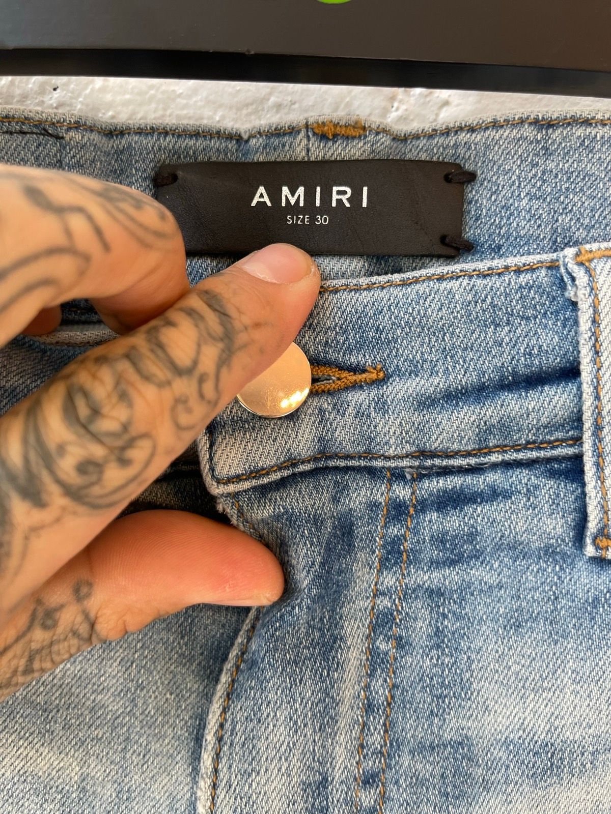 Amiri Blue distressed Knee rip jeans